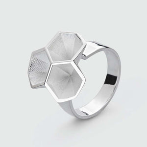 Silver honeycomb ring in full view.
