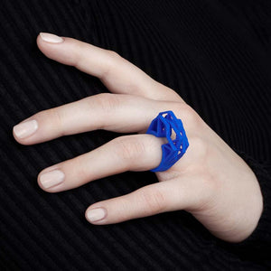 Royal blue big statement ring on finger.