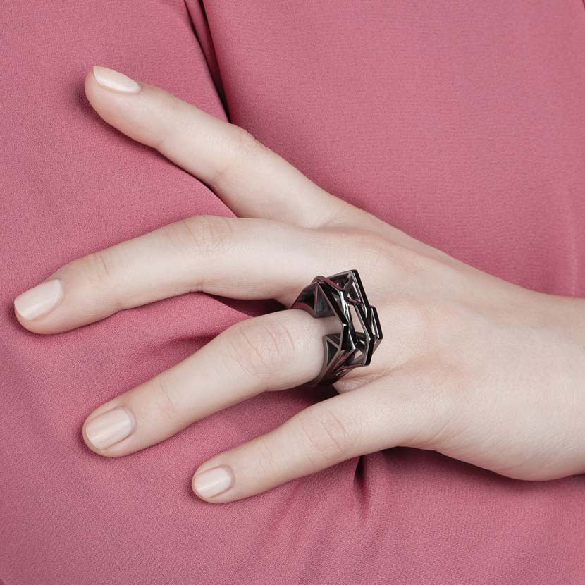 Black cocktail ring in use.