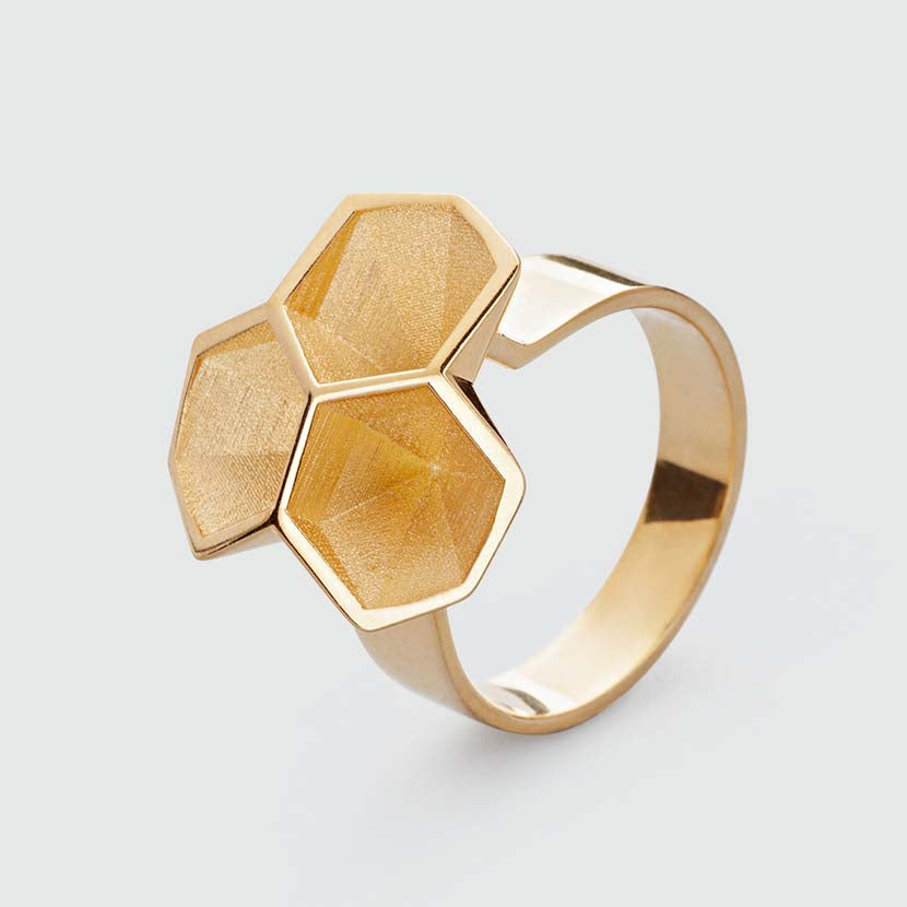 Calyx ring in gold plated brass.