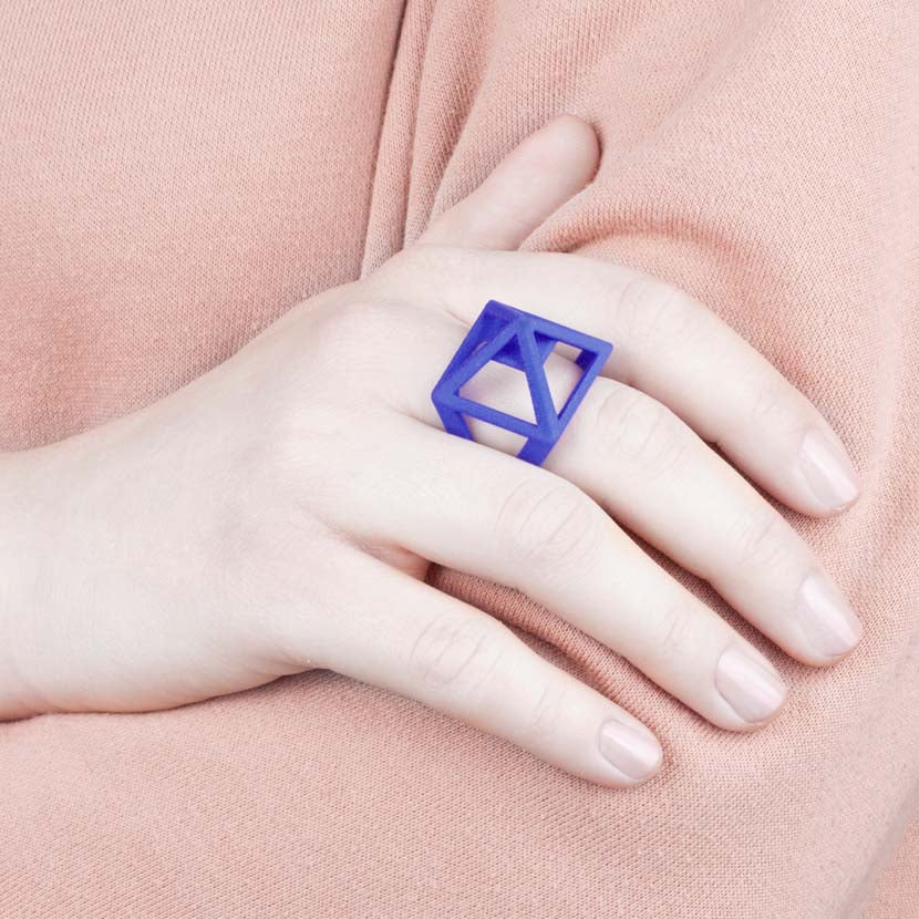 Designer ring shown by model.