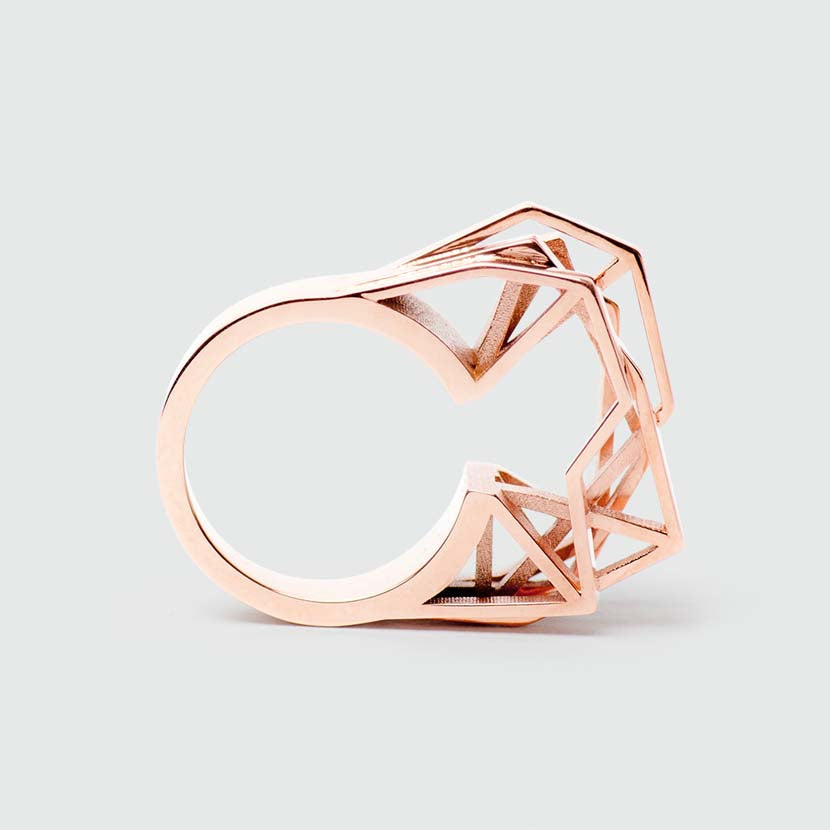 Geometric engagement ring in rose gold side view.