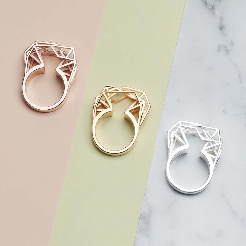 Geometric engagement rings in gold, rose gold and silver.