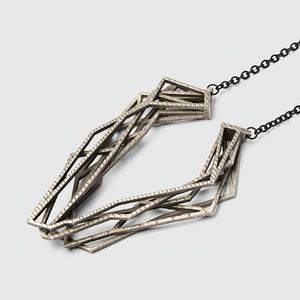 Geometric necklace made of steel.