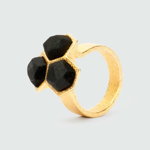Geometric ring gold black mixed.