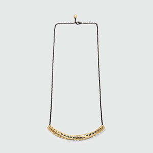Gold geometric necklace of Cubetwist collection.