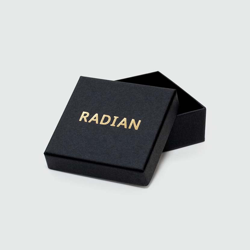 Plain black box with logo for gold architectural earrings.