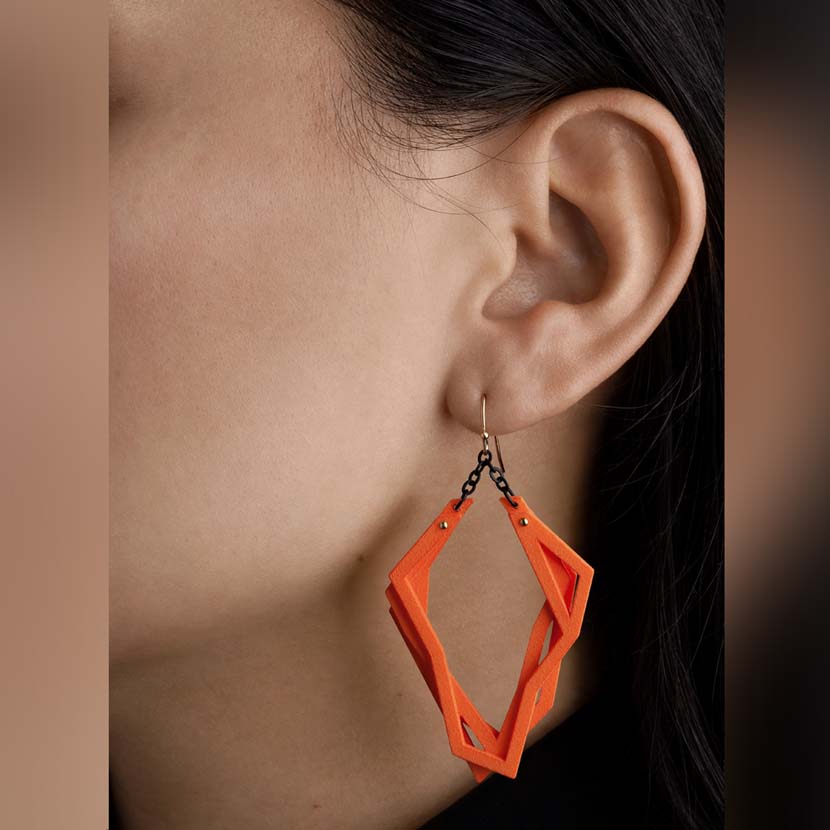 Orange lightweight statement earrings in diamond shape.