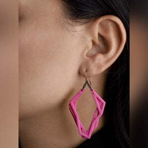 Lightweight statement earrings with pink 3d print.