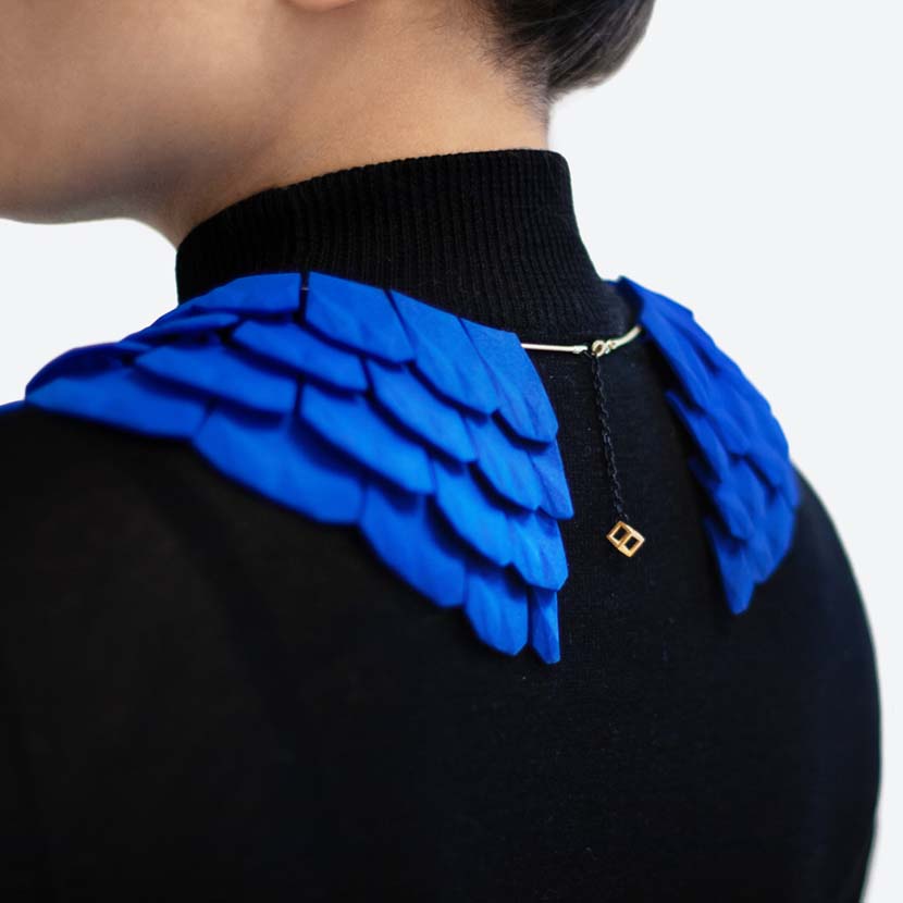 Lynne Maclachlan blue cyan gradient on 3D printed necklace back.