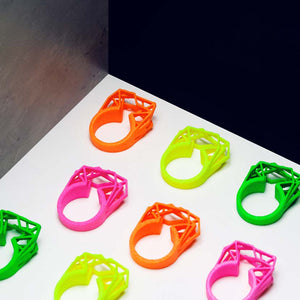 Neon orange ring arranged with more colors.