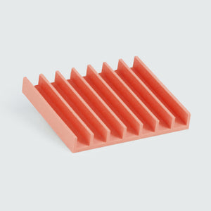 Red soap dish comb shape.
