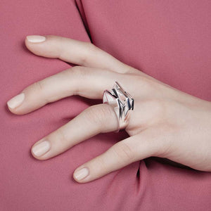 Silver geometric ring on hand model.