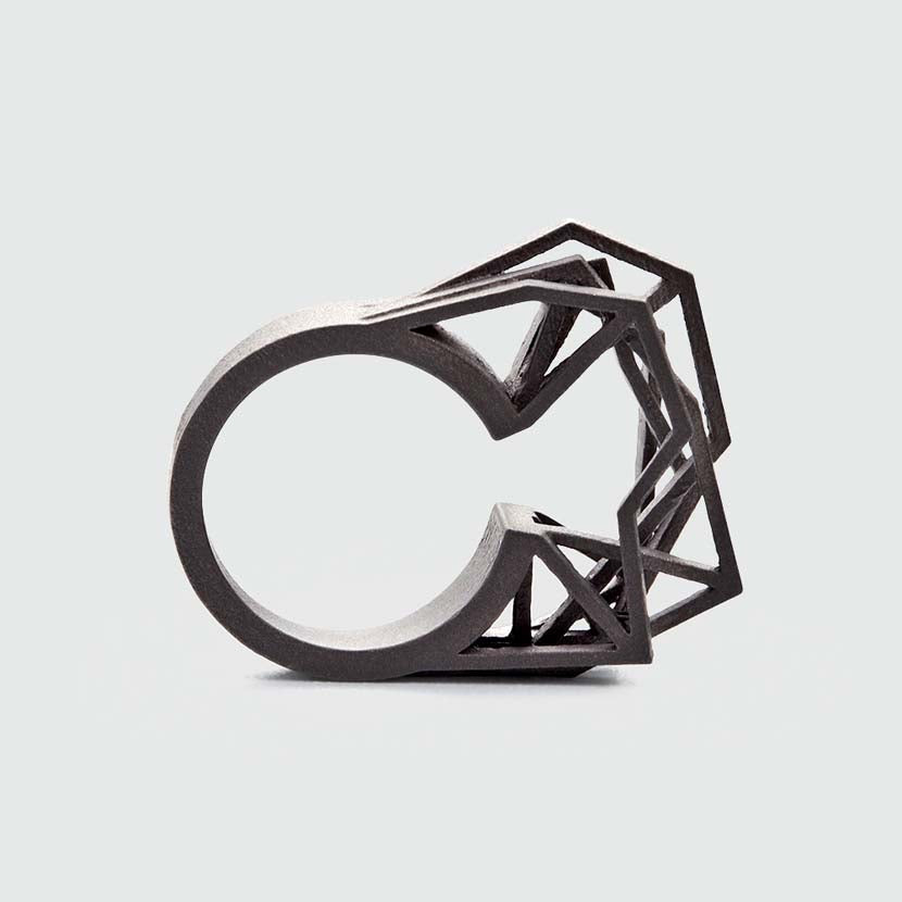 Statement ring titanium with edgy appearance.